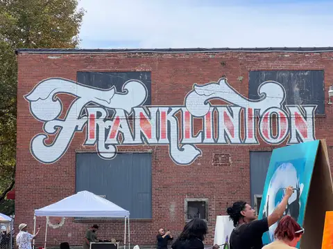 Franklinton's spirit shines bright under its iconic mural.
